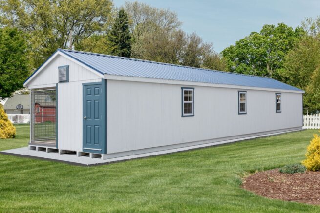 white commercial dog kennels for sale in Montana with blue roof and door